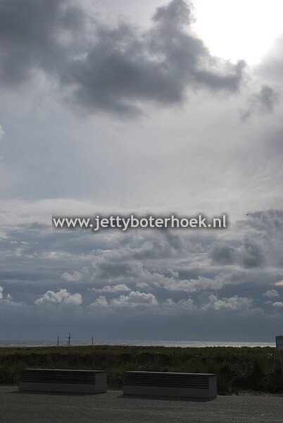Zon, zee, strand & wolken